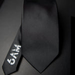 6AM Formal Black Tie in sleek black with 6AM logo on the tail, perfect for pairing with the 6AM WorkShirt.