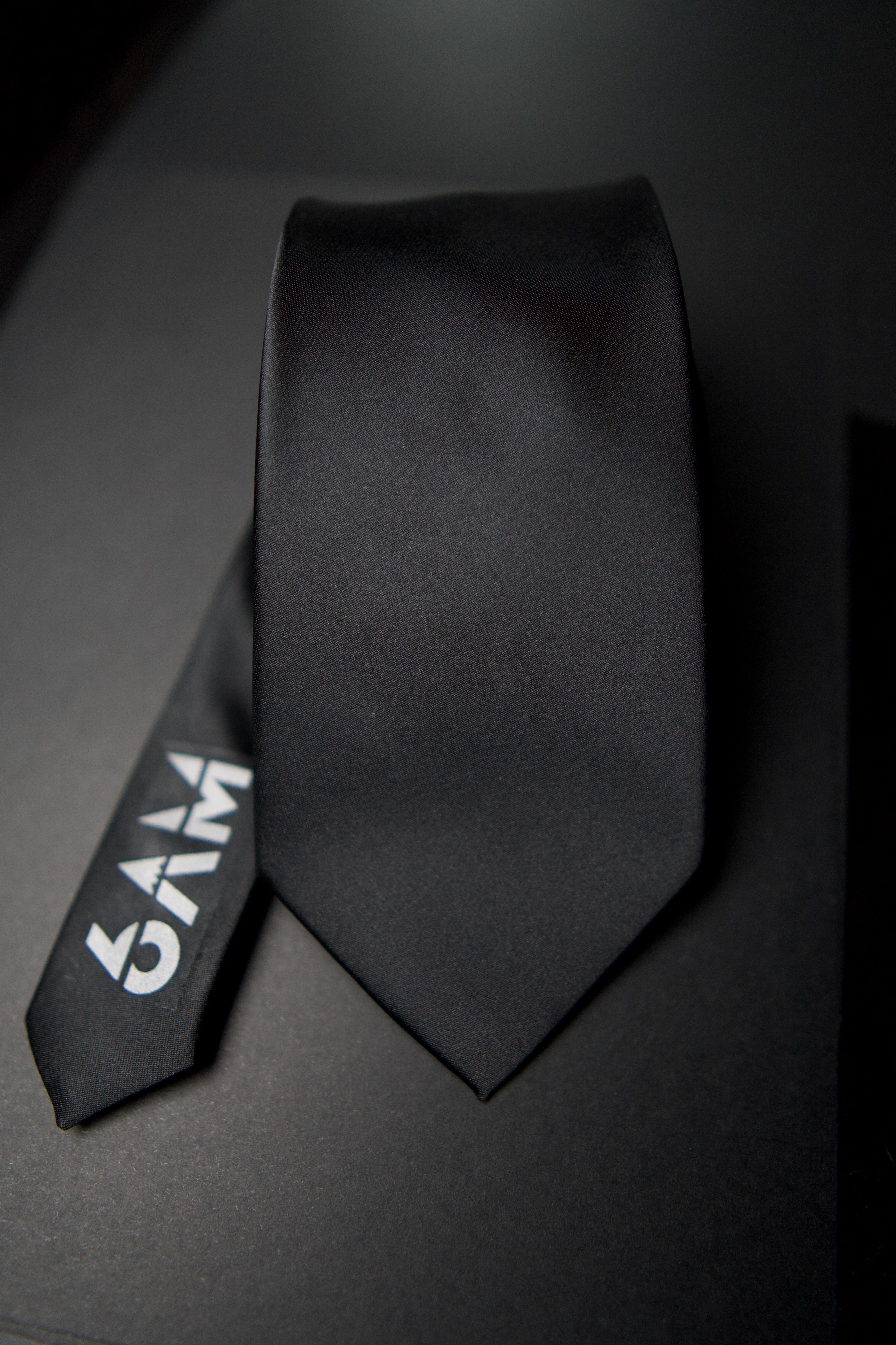 6AM Formal Black Tie in sleek black with 6AM logo on the tail, perfect for pairing with the 6AM WorkShirt.