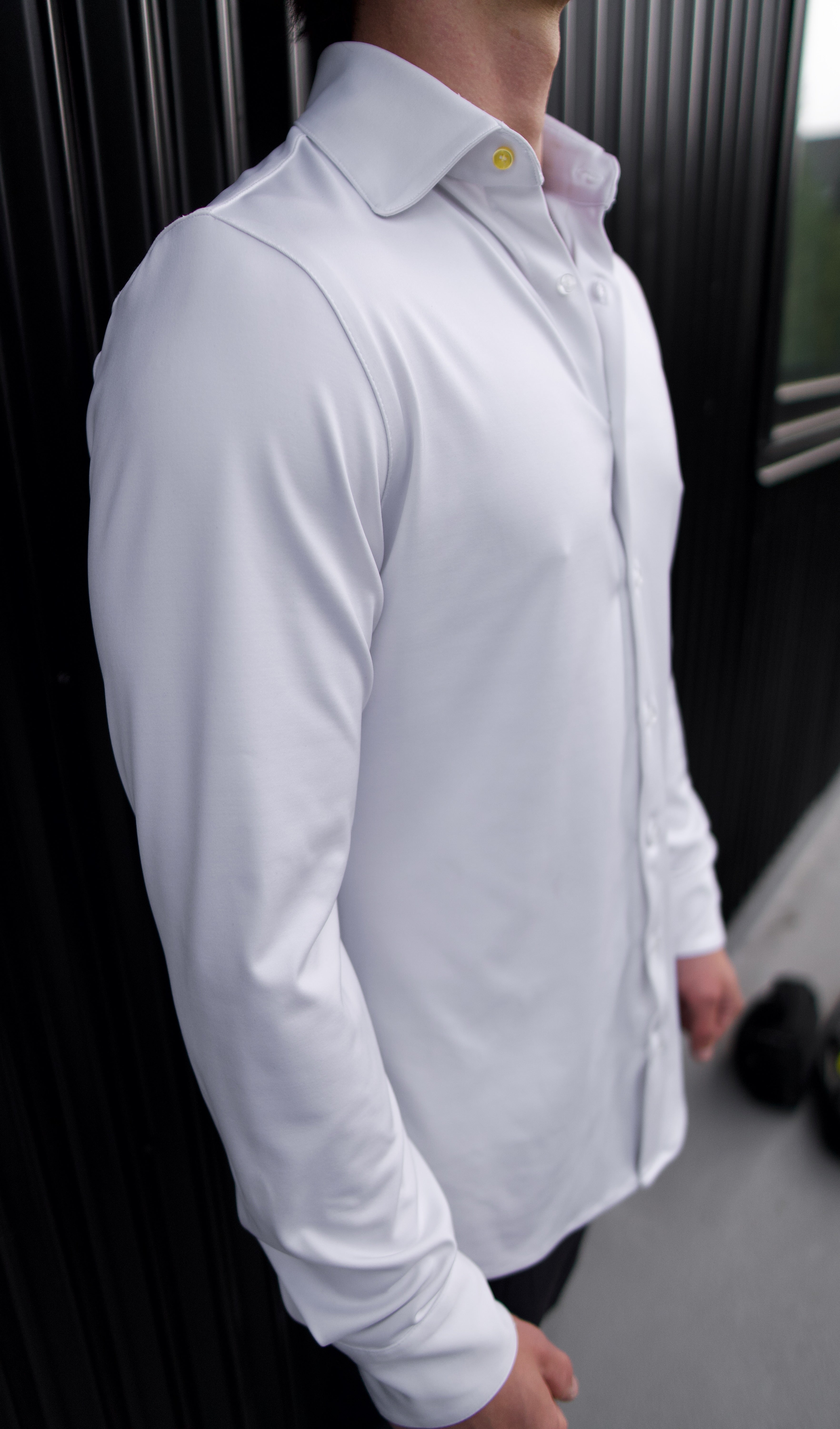Man wearing a white Never-Iron Work Shirt highlighting its smooth, wrinkle-free fabric and tailored fit.