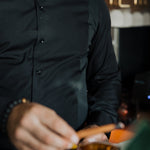 Men's Work Shirt slim-fit black sweat-proof work shirt with 4-way stretch and antimicrobial fabric technology.