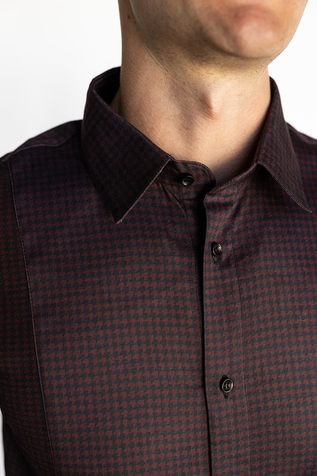 Close-up of the men's Bordeaux Arrowhead WorkShirt collar and burgundy and black geometric micro-pattern.