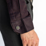 Close-up of the Bordeaux Arrowhead WorkShirt cuff showing the burgundy and black pattern and button detail.