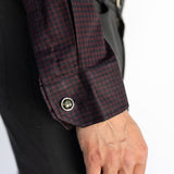 Close-up of the Bordeaux Arrowhead WorkShirt cuff showing the burgundy and black pattern and button detail.