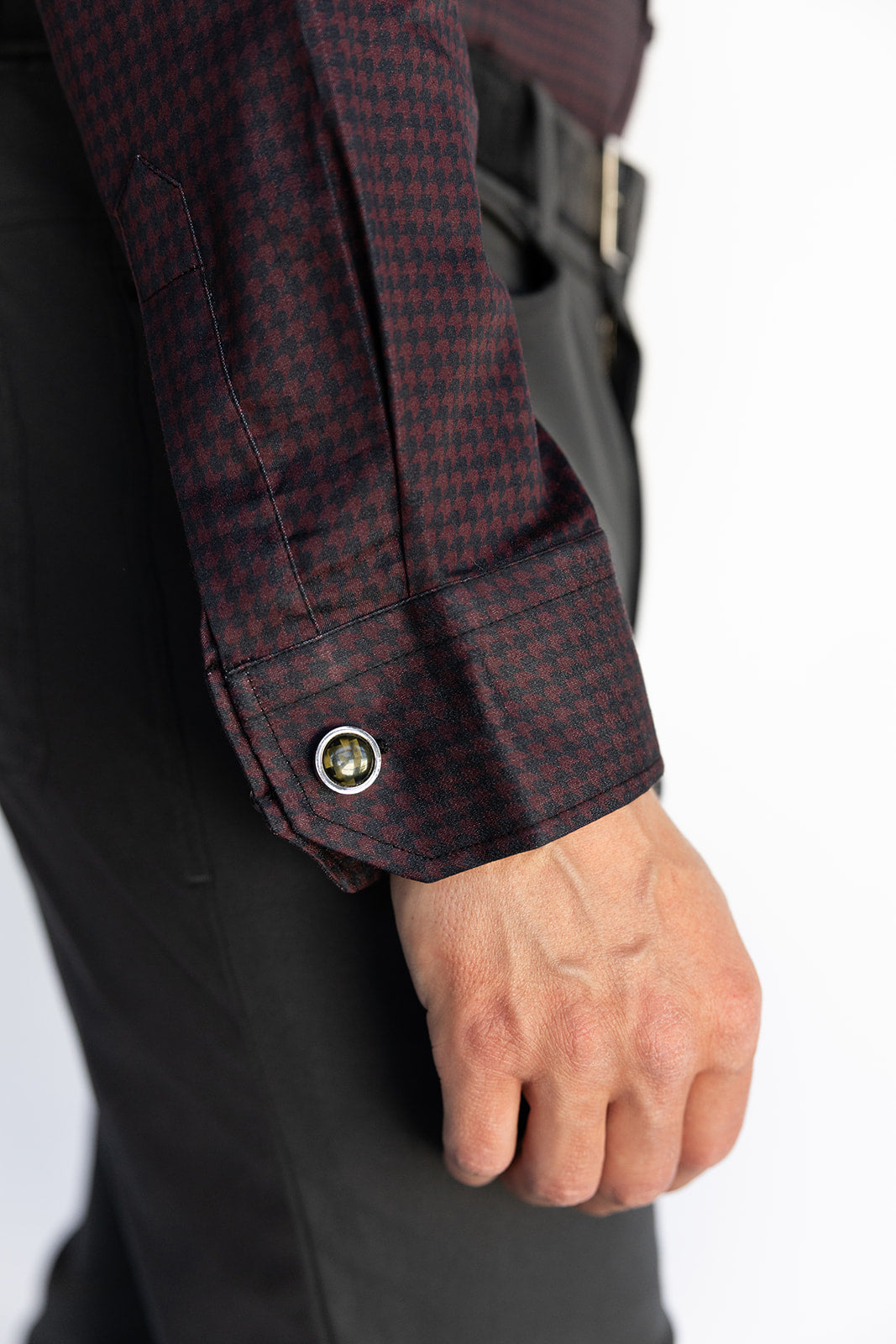 Close-up of the Bordeaux Arrowhead WorkShirt cuff showing the burgundy and black pattern and button detail.