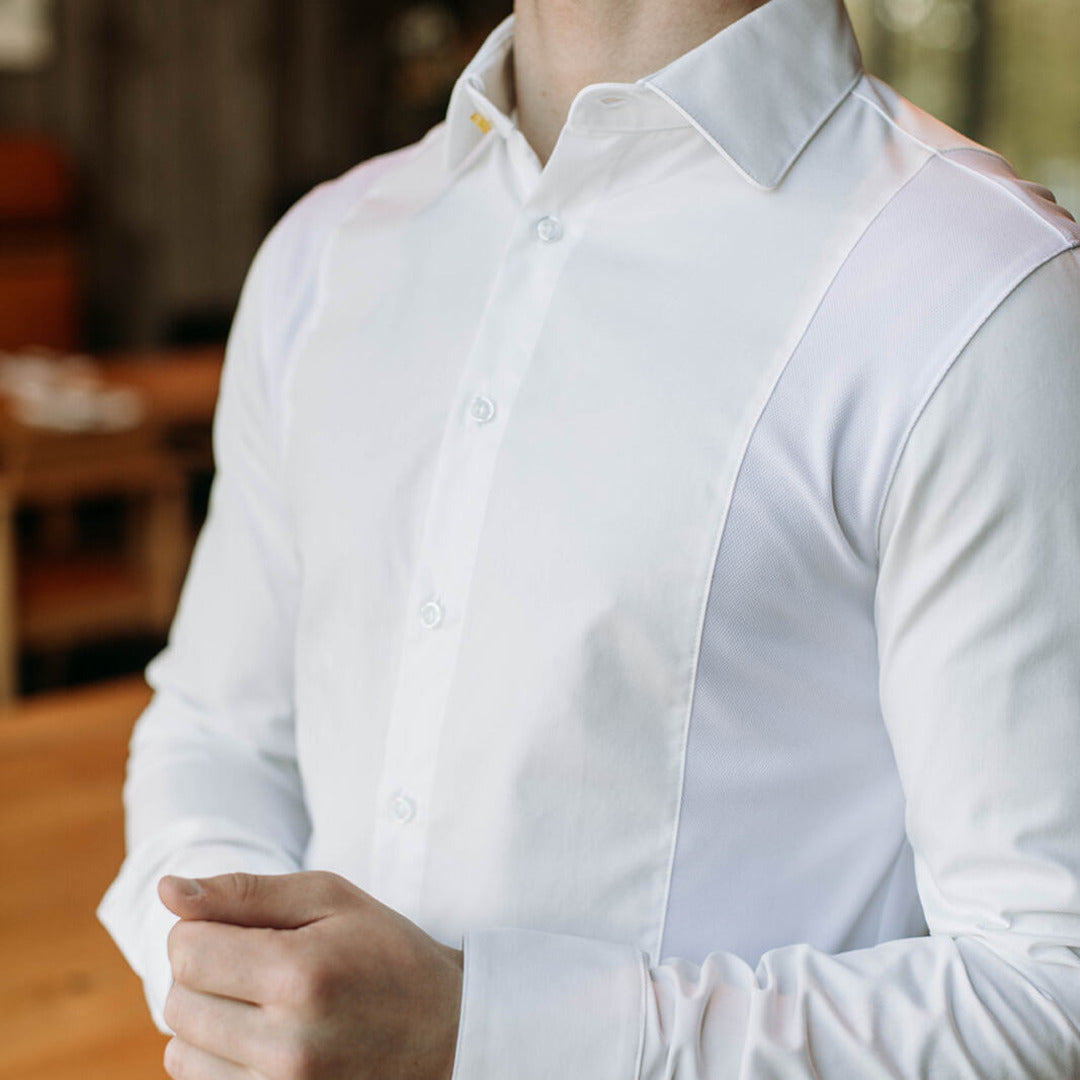 The side of a model wearing a white sweatproof dress shirt for men