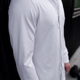 Man wearing a white Never-Iron Work Shirt highlighting its smooth, wrinkle-free fabric and tailored fit.