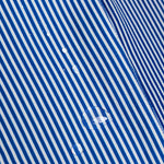 Close-up of blue and white striped fabric with visible texture and water droplet
