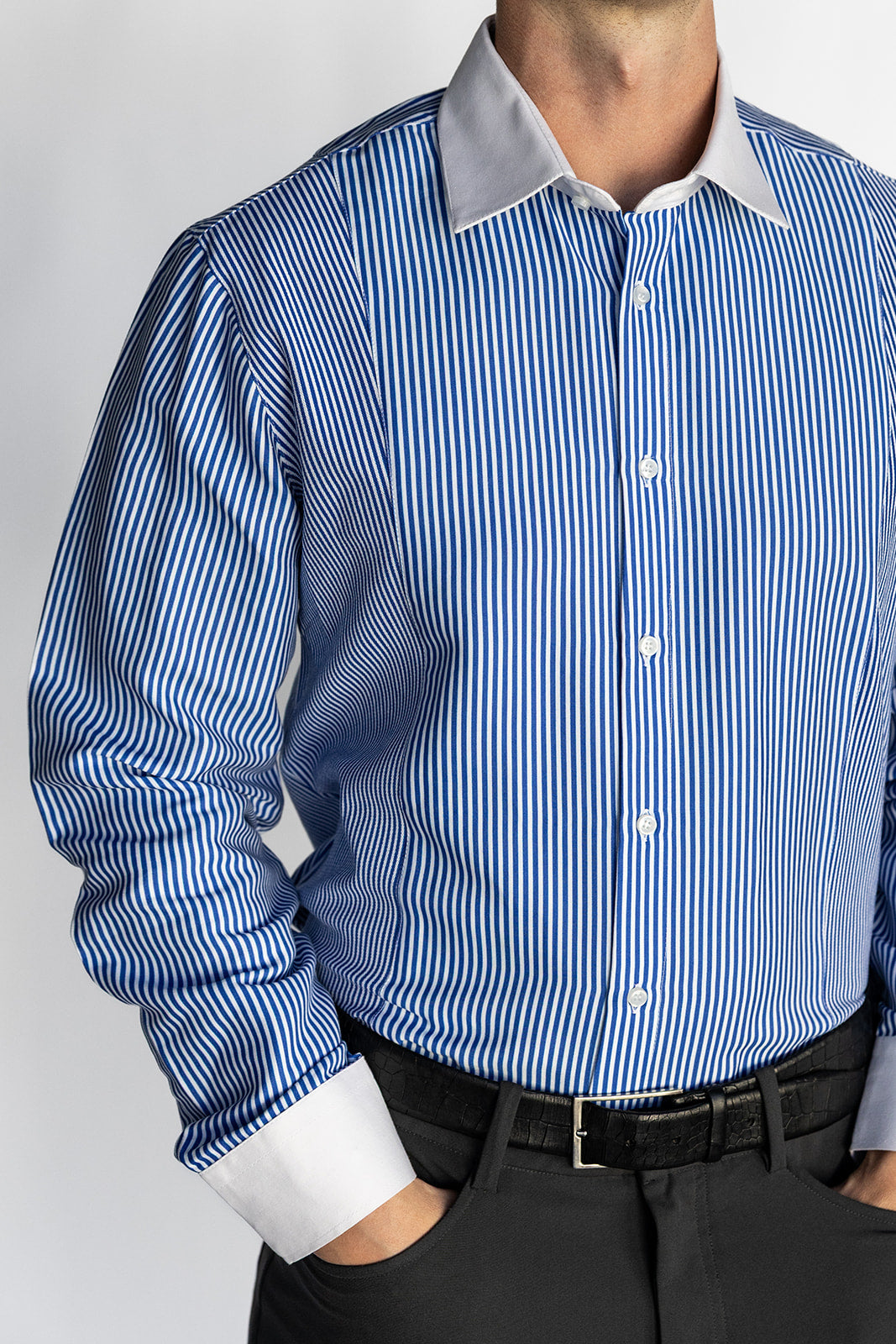 Blue and white striped shirt with a gray collar on a plain background