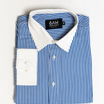 Folded blue and white striped shirt with a visible brand label on a light gray background