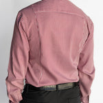Man wearing a red and white striped dress shirt with black pants on a white background