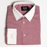 Folded red and white striped shirt with a visible brand label on a light gray background
