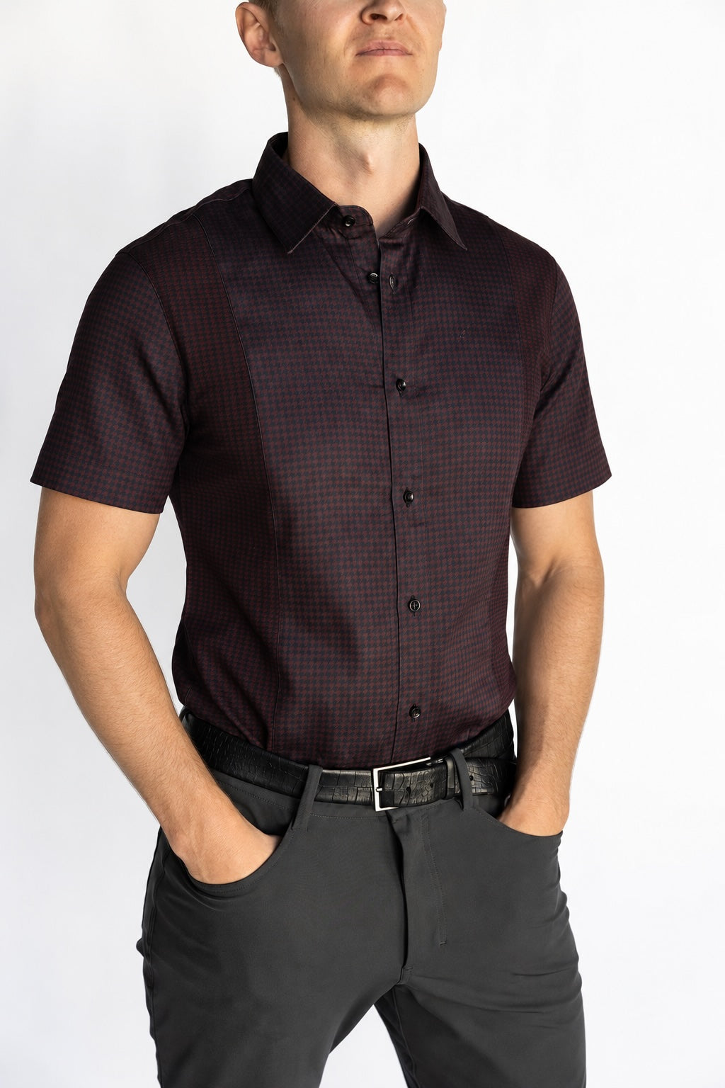 Man wearing the short-sleeve Bordeaux Arrowhead WorkShirt in a deep burgundy and black geometric pattern, front detail view.