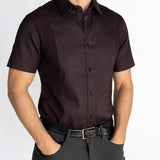 Man wearing the short-sleeve Bordeaux Arrowhead WorkShirt in a deep burgundy and black geometric pattern, front detail view.