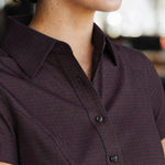 Close-up of the Women’s short-sleeve Bordeaux Arrowhead WorkShirt showing the collar, buttons and geometric pattern.