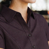 Close-up of the Women’s short-sleeve Bordeaux Arrowhead WorkShirt showing the collar, buttons and geometric pattern.