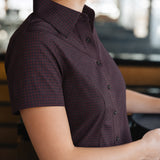 Side view of the Women’s short-sleeve Bordeaux Arrowhead WorkShirt showing the burgundy and black pattern and tailored fit.