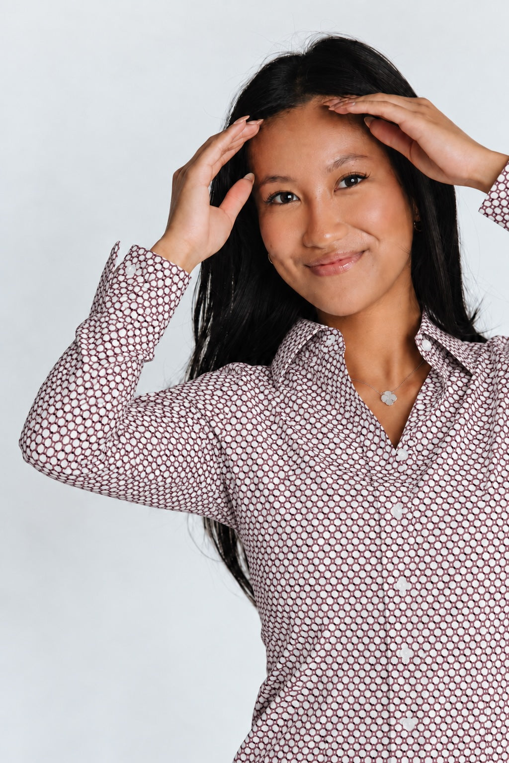 Close front view of women’s ruby hexagon-pattern long-sleeve WorkShirt with white buttons.