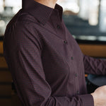 Side view of the Women’s Long Sleeve Bordeaux Arrowhead WorkShirt showing the burgundy and black geometric pattern and tailored fit.
